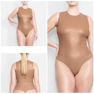 SKIMS Faux Leather Bodysuit and Shorts in Sienna